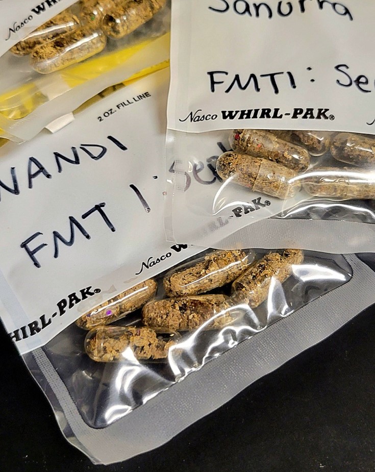 A clear bag holds several clear pills with animal feces inside.